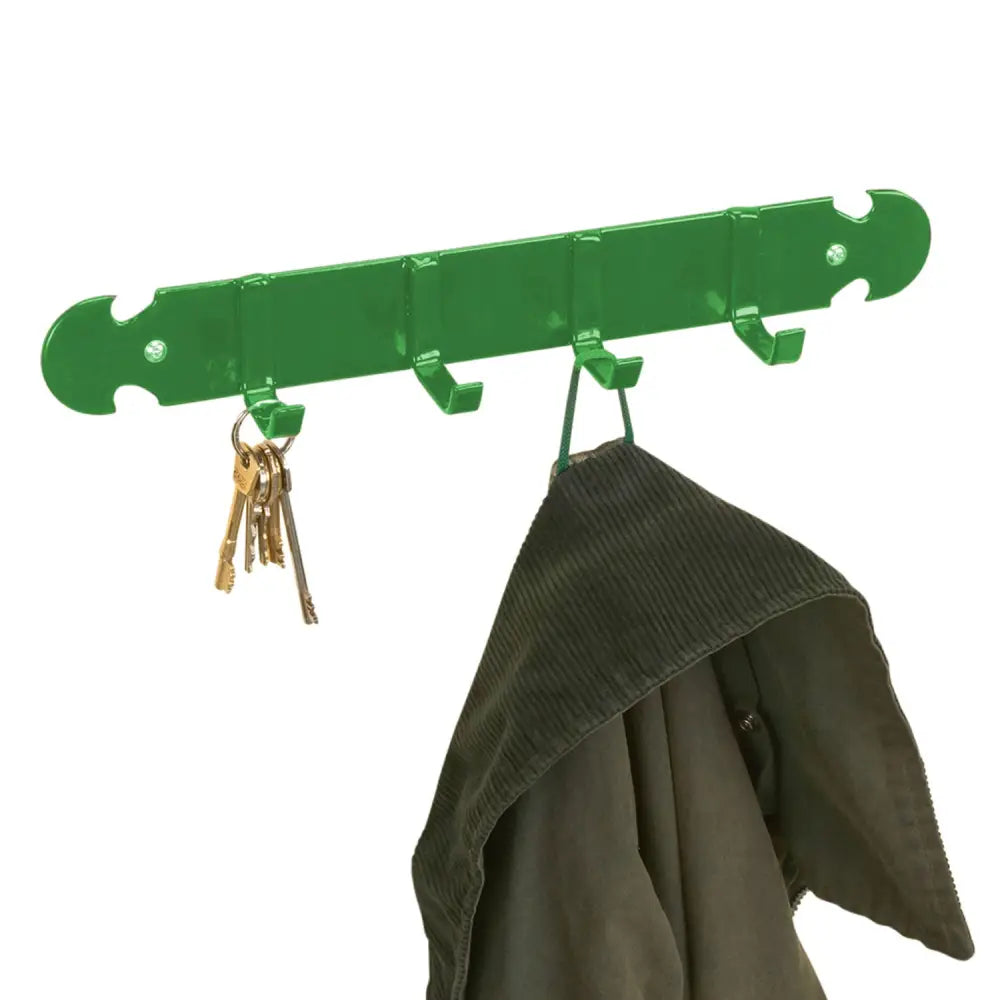 Green metal stubbs coat and key rack with four bridle hooks for tack room organization mounted on wall