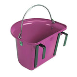 A vibrant magenta metal stubbs grooming bucket with a curved silver handle and black side stable door handles