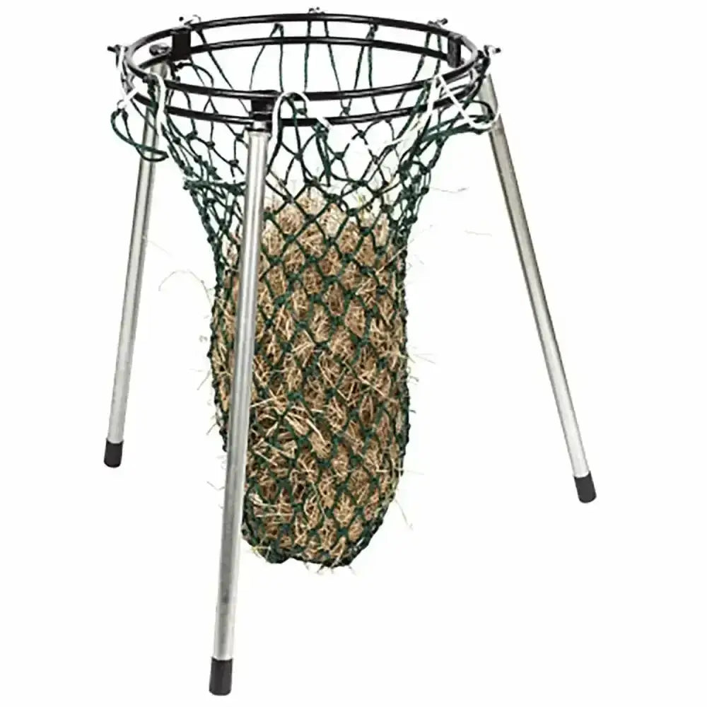 Black metal floor standing haynet with three legs holding a green mesh stubbs nets haynet filler filled with straw