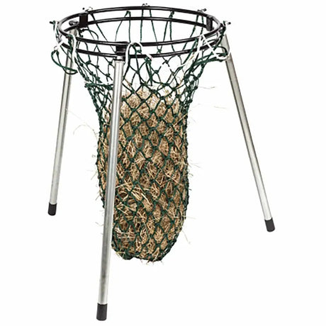 Black metal floor standing haynet holding a green mesh stubbs nets filled with straw as standing haynet fillers