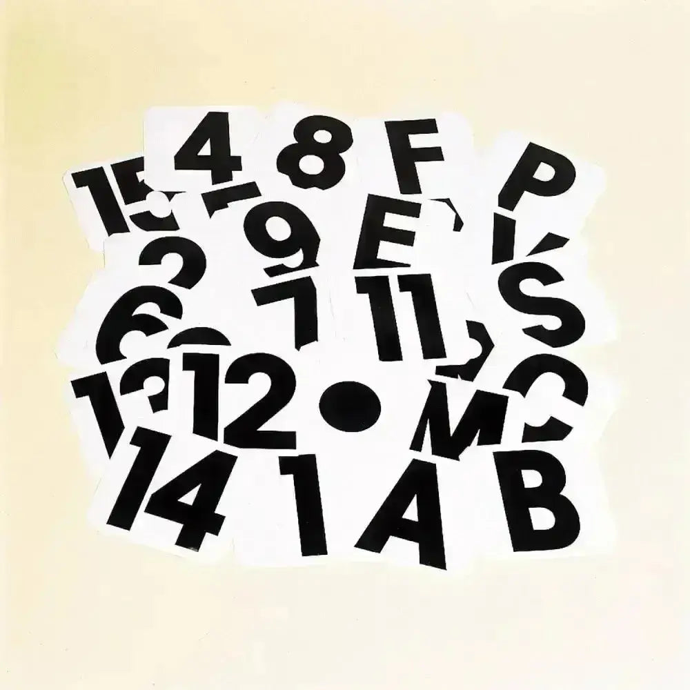 Black plastic self adhesive labels dressage letters abcefhkmpv scattered on a light background