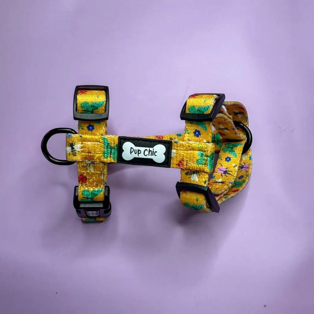 Summer buzzin yellow floral puppy strap harness with black buckles and bone shaped pup chic tag for teacup puppies