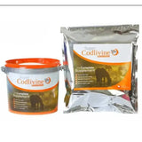Orange and white labeled bucket with silver lid next to shiny metallic pouch of super codlivine complete supplement supports broad spectrum health