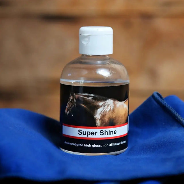 Clear plastic bottle of super shine lotion 250ml with white cap featuring concentrated high gloss oil based formula and horse head image
