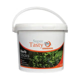 White plastic bucket with handle labeled super tasty herb sticks in orange and black for tasty herb sticks horse treats
