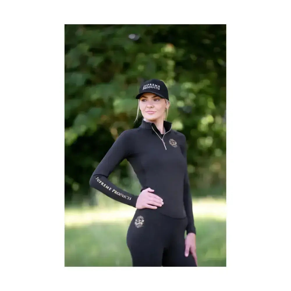 Black long-sleeved supreme products active rider base layer top with zip neck and branding on sleeve and cap