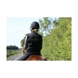 Black equestrian helmet with sleek smooth finish and subtle branding on the back for supreme products active rider gilet
