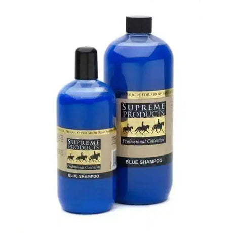 Two blue plastic bottles of supreme products blue shampoo professional with black caps showing blue shampoo works effectively