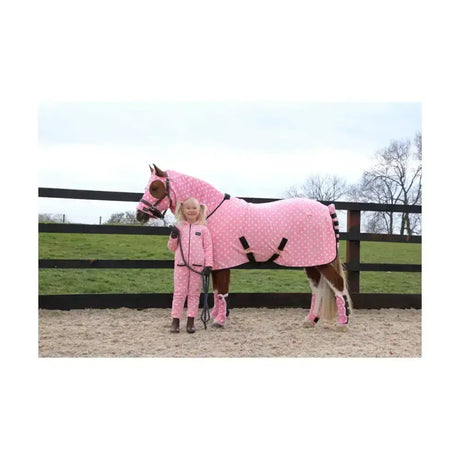 Pink polka-dot fleece horse blanket with black straps and matching leg wraps from supreme products childs dotty fleece onesie