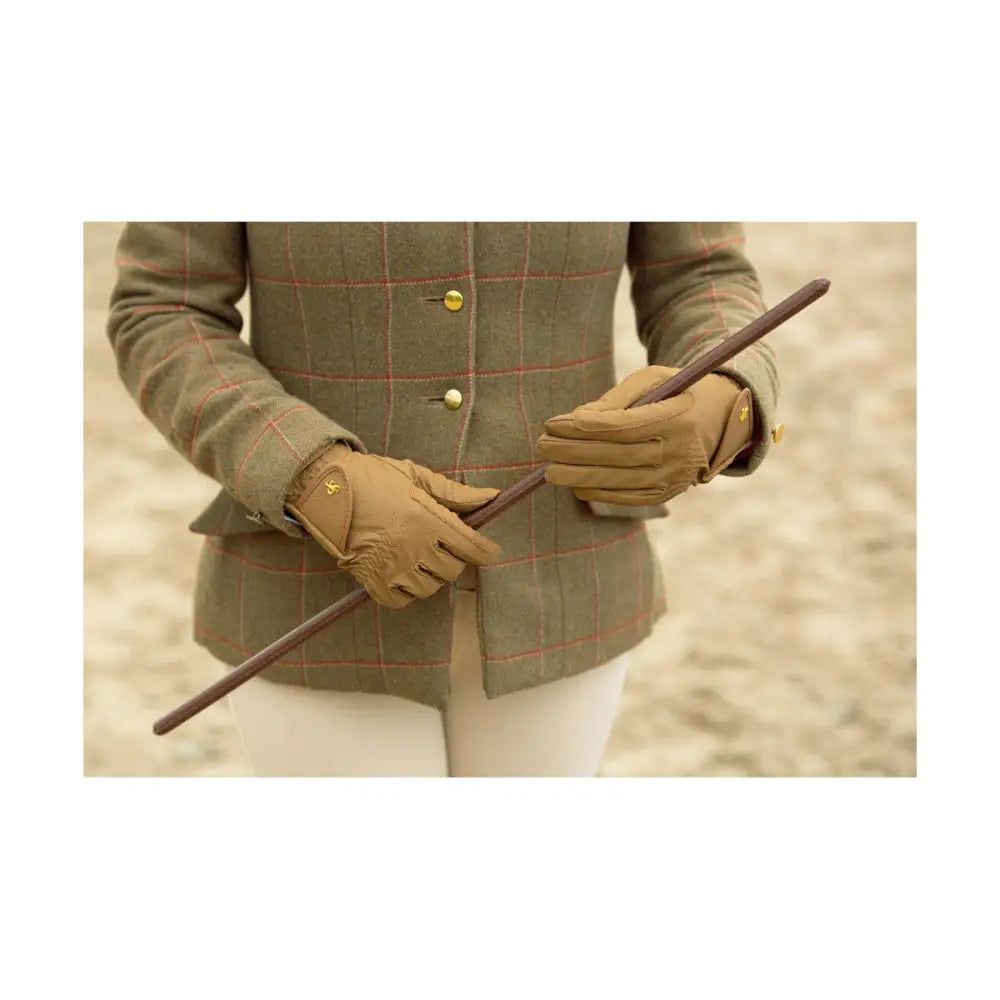 Tan leather riding gloves with gold tone stitching and small logo on back showing supreme products classic style