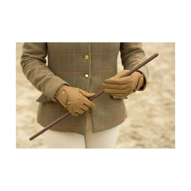 Tan leather riding gloves with gold tone stitching and small logo on back showing supreme products classic style