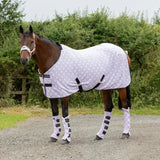 White polka-dot supreme products dotty fleece rug with black straps and matching leg wraps for versatile soft fleece warmth