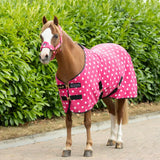 Pink polka-dot supreme products dotty fleece rug with black trim and buckle closures made from versatile soft fleece