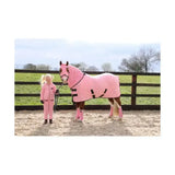 Pink polka-dot supreme products dotty fleece rug with black straps and matching leg wraps for soft versatile use