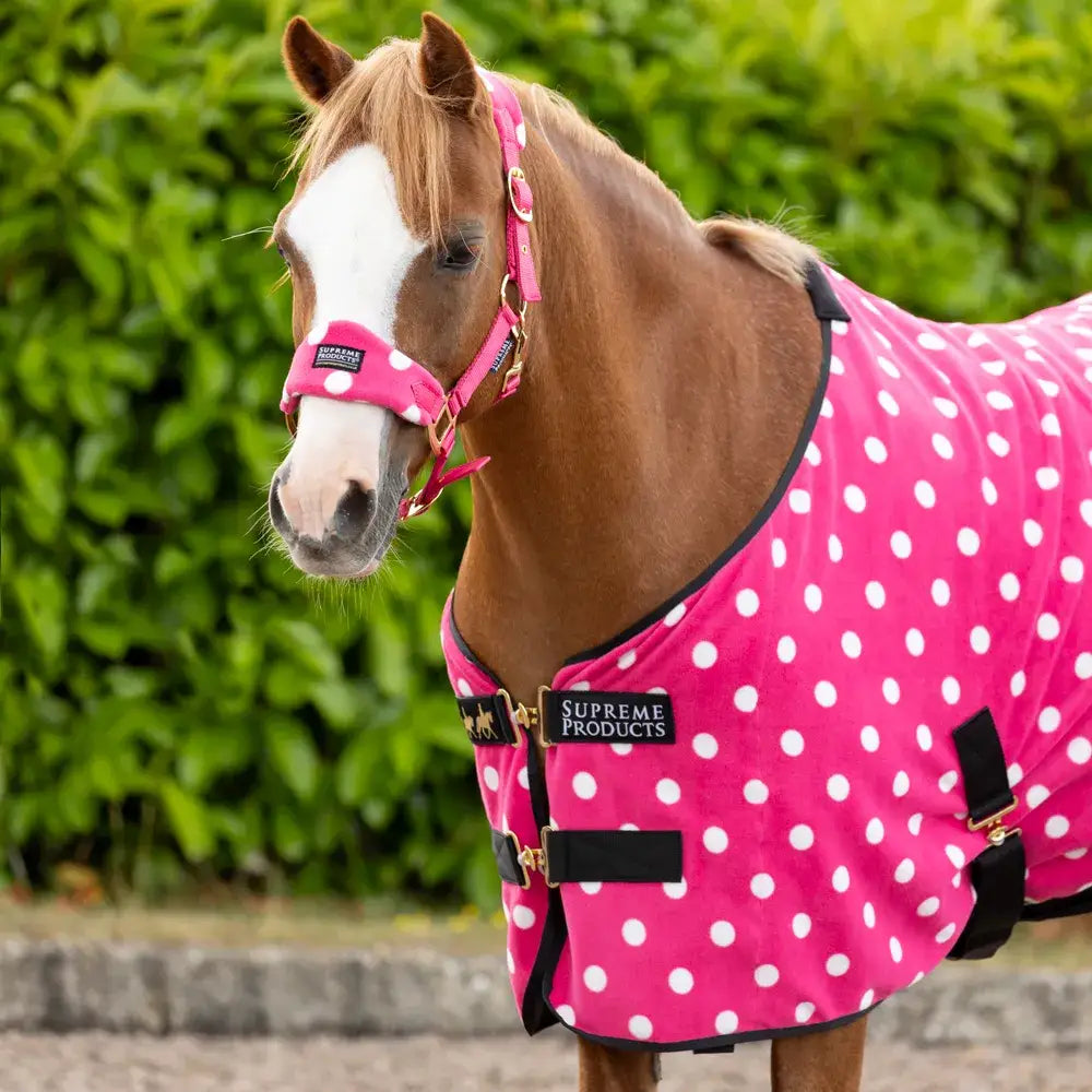 Pink polka-dot supreme products dotty fleece rug with black trim gold hardware versatile soft fleece horse blanket