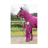 Vibrant magenta supreme products dotty fleece rug with white polka dots and matching versatile soft fleece riding gear