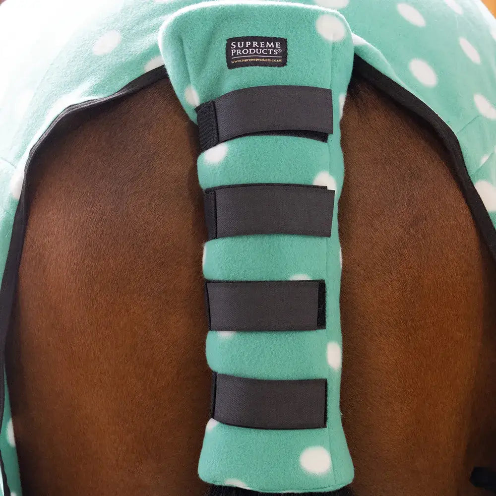 Teal polka-dot fleece tail guard with black velcro straps showing back side from supreme products dotty fleece tail guard