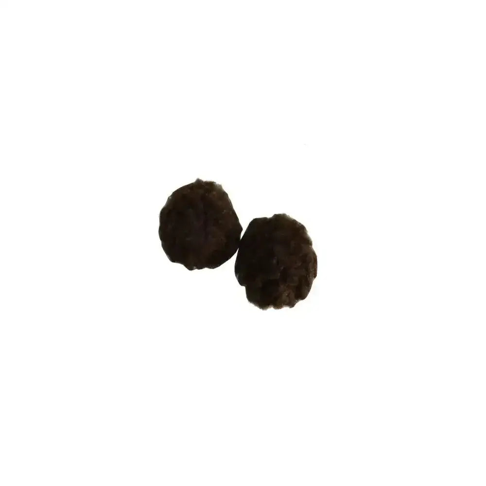 Two dark textured peppercorns shown with supreme products fleece earplugs designed for horse size comfort