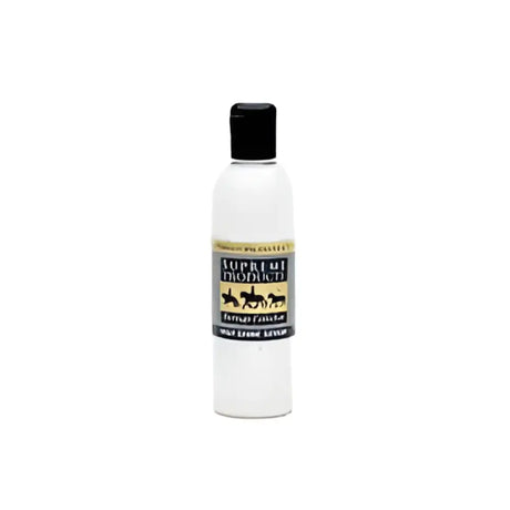 A clear plastic bottle with a black cap of supreme products heritage high shine serum featuring gold lettering and horses