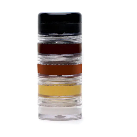 Clear cylindrical container with black lid showing supreme products stacking palette with amber brown and dark brown layers
