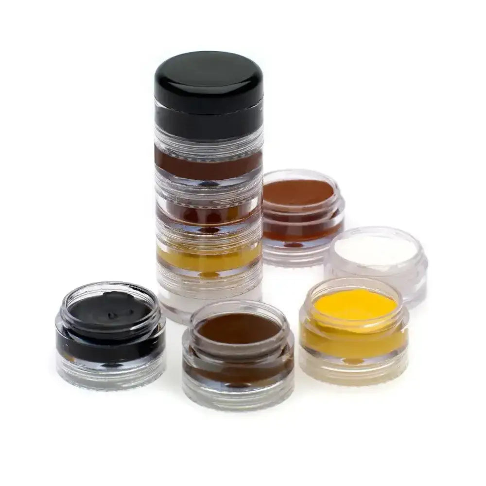 Stacked transparent containers with black lids hold brown yellow and white powders in the supreme products stacking palette