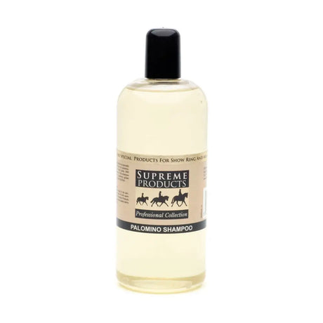 A clear plastic bottle with black cap holds pale yellow palomino shampoo from supreme products for palomino coats