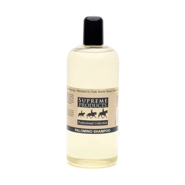 A clear plastic bottle with black cap holds pale yellow palomino shampoo from supreme products for palomino coats
