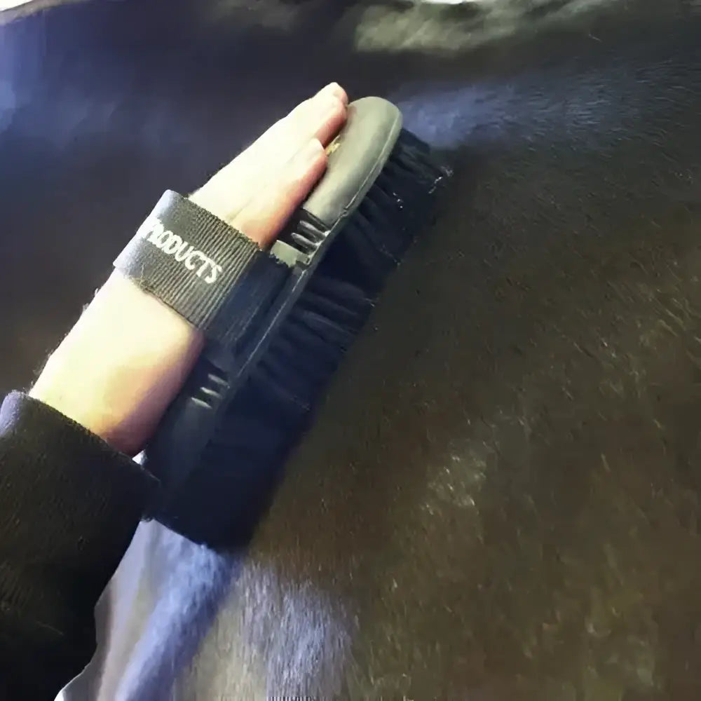 Black supreme products pro groom body brush with gray grip and products printed for easy horse grooming