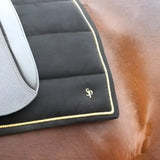 Black quilted lightweight saddle pad with gold stitching and sp logo from supreme products royal occasion suede saddle