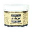 White plastic tub of supreme products soft leather soap with beige label and black horse silhouettes for luxurious leather care