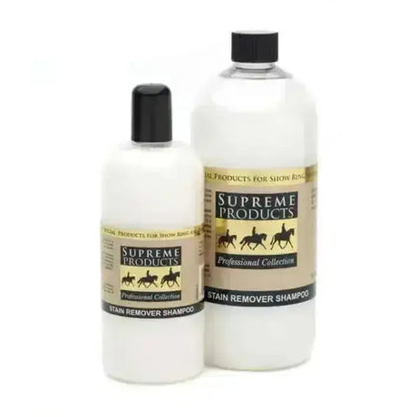 Two transparent plastic bottles of supreme products stain remover shampoo with black caps and gold-and-black labels for established stains
