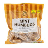 A bag of sweet heaven sweets mint humbugs with orange and brown stripes and clear windows showing mint sweets inside