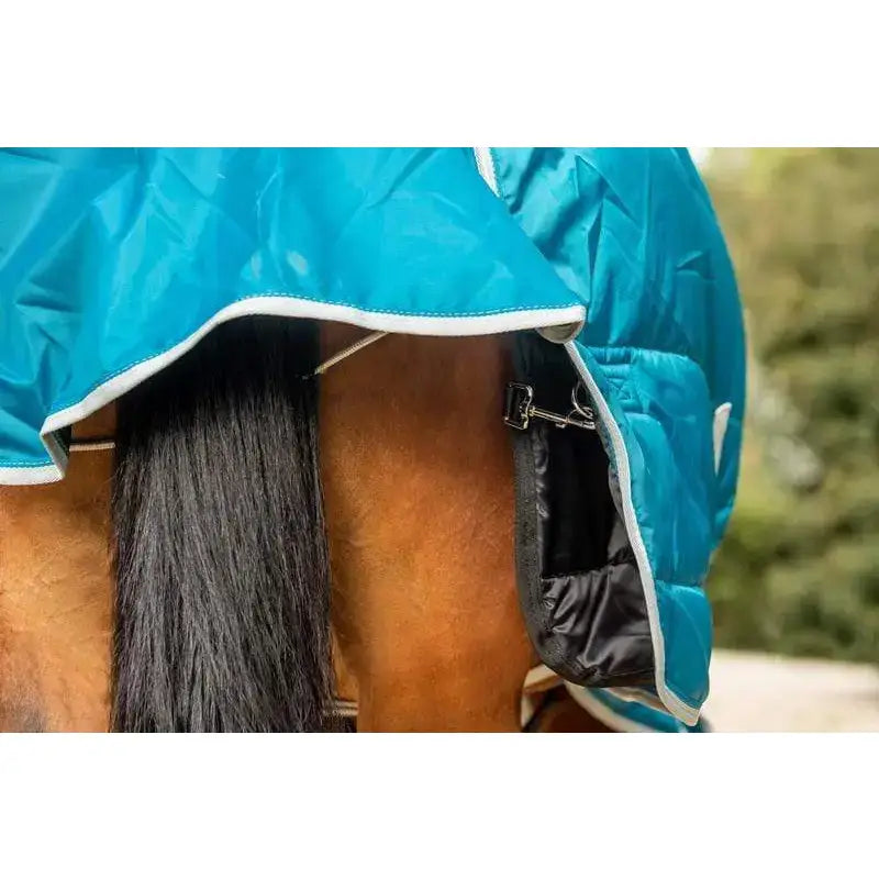 Bright blue quilted swish 100g horse rug liner with white trim and black breathable inner lining for all seasons
