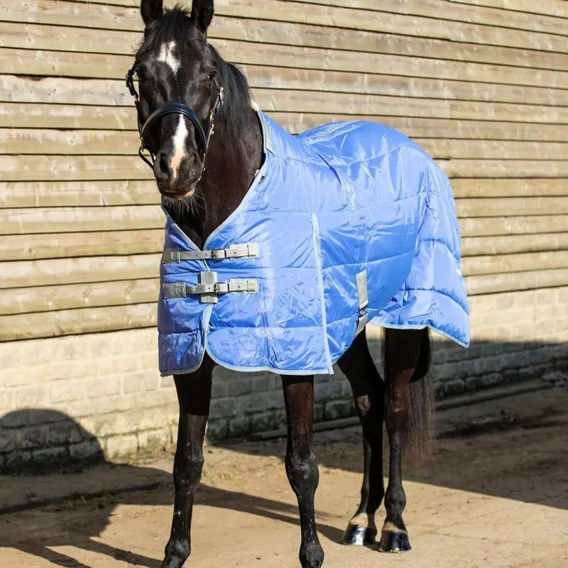 Blue quilted lightweight stable rug with silver buckles and soft nylon lining features detachable neck cornflower color