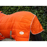 Bright orange lightweight stable rug with detachable neck and soft nylon lining featuring white trim and logo patch