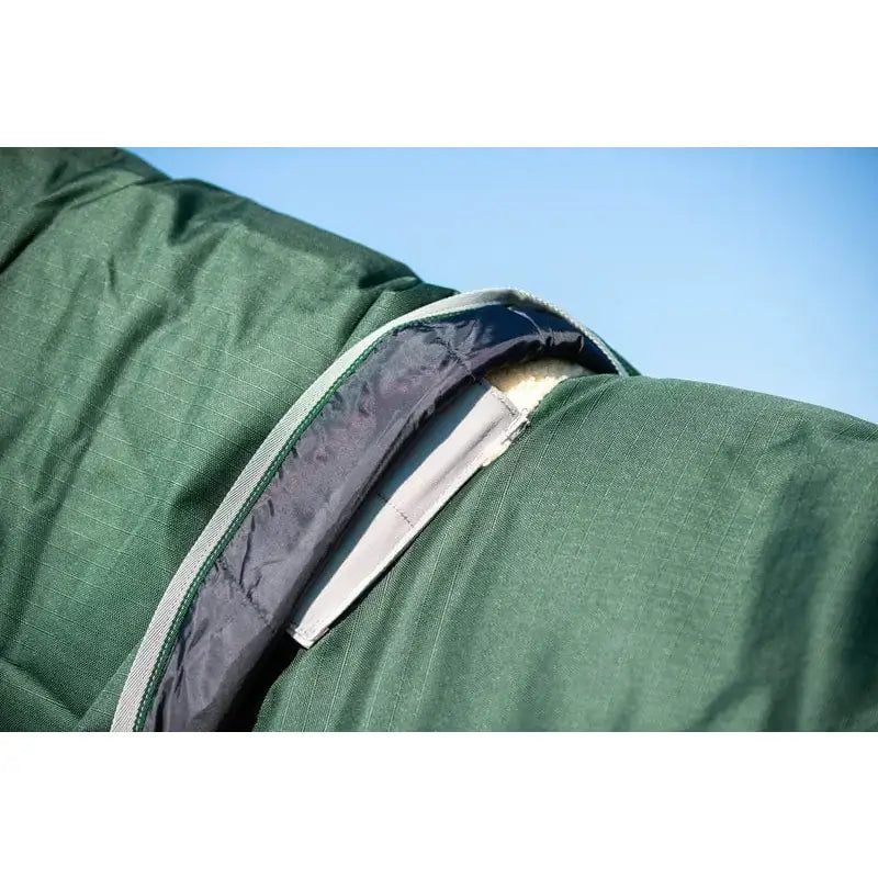 Green quilted swish 200g detachable neck turnout rug with dark gray zipper and light gray trim in hunter green