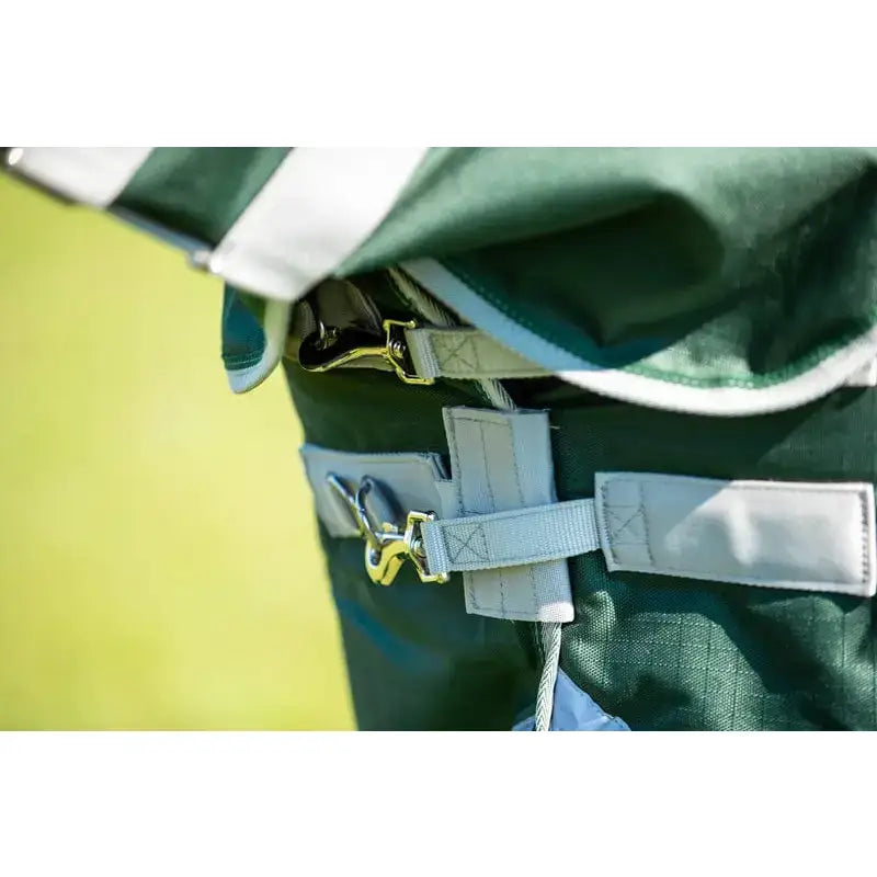 Green and white swish 200g detachable neck turnout rug with sturdy straps and gold-toned metal buckles in hunter green