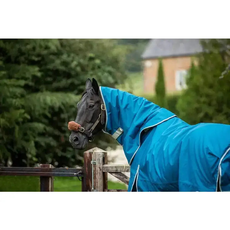 Bright blue 300g turnout rug with detachable neck turquoise and white trim featuring reflective strips