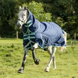 Navy blue turnout rug with teal trim and adjustable straps featuring a detachable neck turnout neck cover included