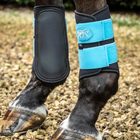Bright blue and black Swish double locking brushing boots with padded strike pad and breathable neoprene horse leg wraps