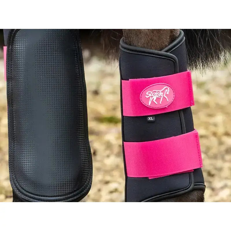 Black and bright pink swish double locking brushing boots with adjustable straps padded strike pad and breathable neoprene