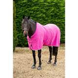 Bright pink luxury fleece rug mulberry with white trim and silver buckles featuring cross surcingles for horses