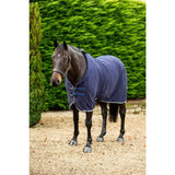 Navy swish fleece horse rug with breathable cross surcingles white trim and silver piping for cozy warmth