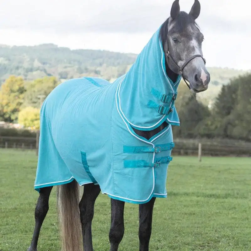 Turquoise swish fleece rug with neck cover featuring white trim and adjustable straps for luxury fleece comfort