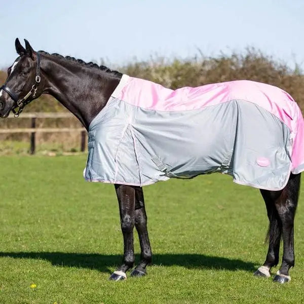 A sleek fly turnout combination rug mesh baby in baby pink with a detachable neck cover and reflective silver-gray panel