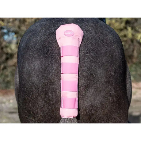 Swish horse tail padded protector in baby pink with adjustable velcro straps and branded logo visible from the back side