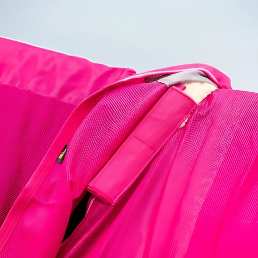 Bright pink mesh fly rug with zipper and strap detail featuring detachable neck cover and large tail flap
