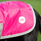 Bright pink swish waterproof dog coat raspberry with gray trim velcro chest and white swish logo patch