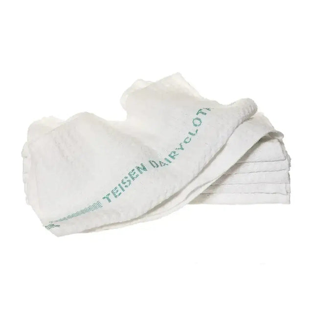 White woven cotton cloth with green teisen dairy cloth text along edge from teisen products dairycloth collection