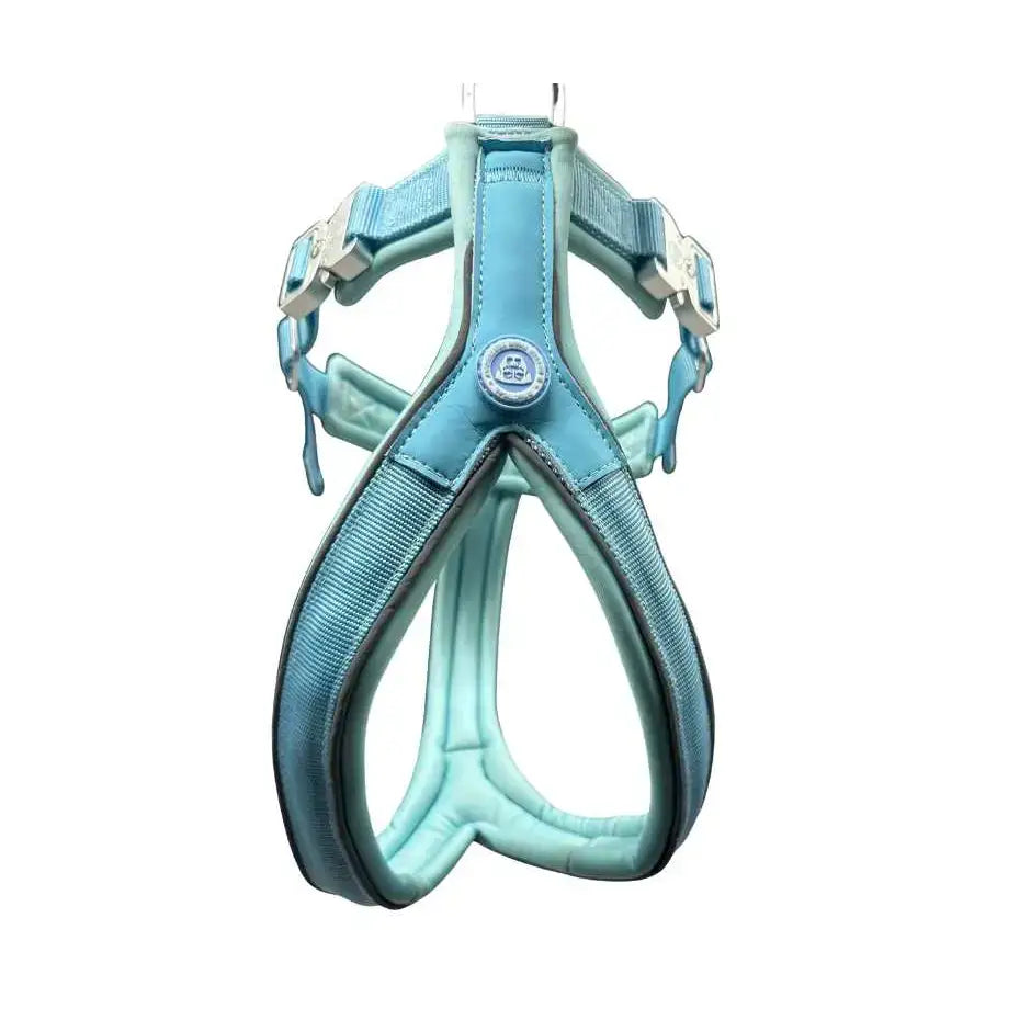 A pastel blue btactical harness with padded straps silver buckles and a slip-on design for easy leash manners